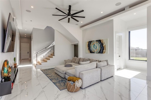 living room with marble finish floor, a ceiling fan, stairs, and recessed lighting
