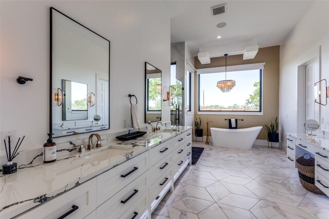 full bath with a healthy amount of sunlight, a sink, visible vents, and double vanity
