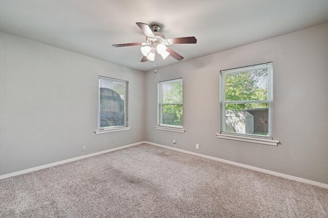 4722 Frontier Trl, Austin, TX 78745 - carpeted spare room featuring a ceiling fan and baseboards