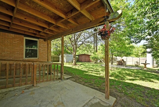 4722 Frontier Trl, Austin, TX 78745 - view of patio featuring an outbuilding, a shed, and a fenced backyard