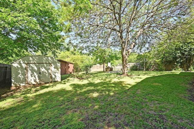 4722 Frontier Trl, Austin, TX 78745 - view of yard with a fenced backyard, an outdoor structure, and a shed