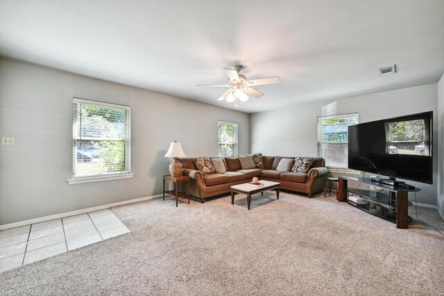 4722 Frontier Trl, Austin, TX 78745 - carpeted living area featuring ceiling fan, visible vents, baseboards, and tile patterned flooring