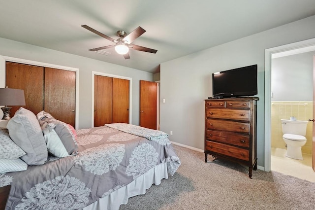 4722 Frontier Trl, Austin, TX 78745 - bedroom with a ceiling fan, multiple closets, carpet, and ensuite bath