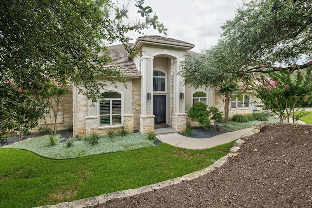 4101 Top Of Texas Trl, Austin, TX 78735 - view of front of home with stone siding, a front lawn, and stucco siding