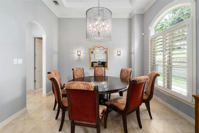 4101 Top Of Texas Trl, Austin, TX 78735 - dining room featuring arched walkways, a chandelier, crown molding, and light tile patterned flooring