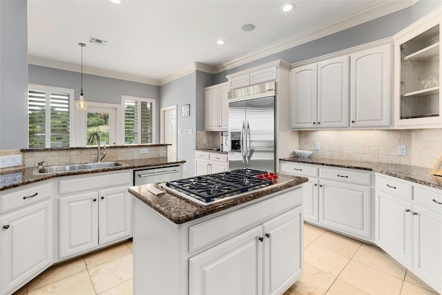 4101 Top Of Texas Trl, Austin, TX 78735 - kitchen with stainless steel appliances, tasteful backsplash, glass insert cabinets, light tile patterned flooring, and recessed lighting