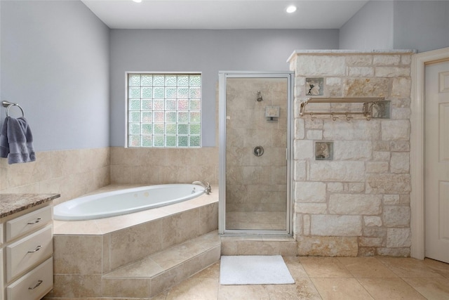 4101 Top Of Texas Trl, Austin, TX 78735 - bathroom featuring a bath, a shower stall, vanity, tile patterned floors, and recessed lighting