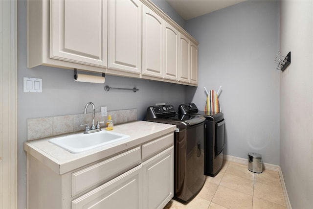 4101 Top Of Texas Trl, Austin, TX 78735 - laundry area featuring cabinet space, washing machine and clothes dryer, and light tile patterned floors