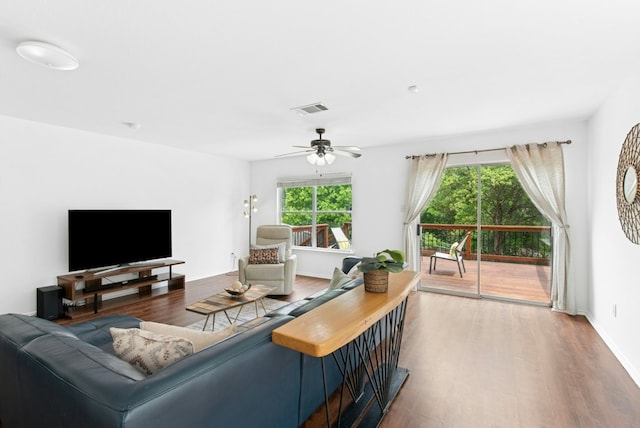 10701 Garbacz Dr, Austin, TX 78748 - living area with wood finished floors, ceiling fan, and baseboards