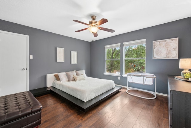 10701 Garbacz Dr, Austin, TX 78748 - bedroom with baseboards, wood finished floors, and a ceiling fan