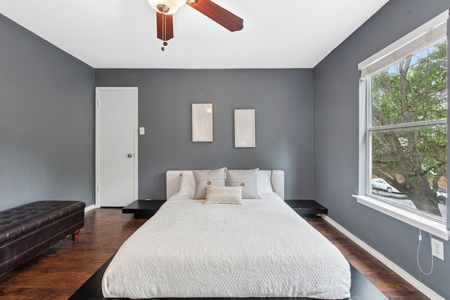 10701 Garbacz Dr, Austin, TX 78748 - bedroom featuring dark wood-style floors, baseboards, and a ceiling fan