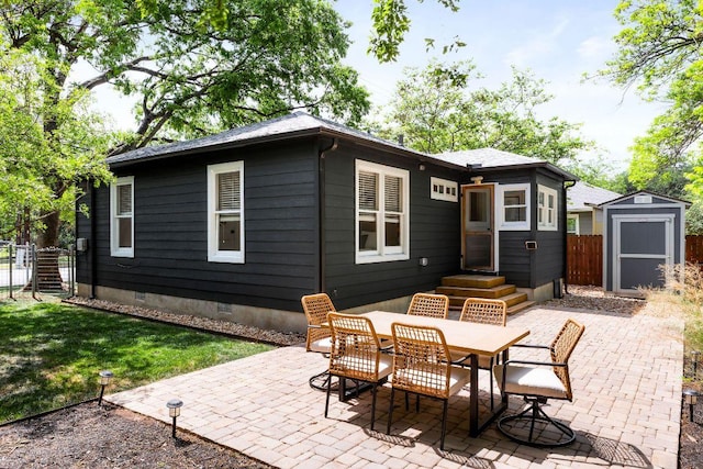 1200 Cullen Ave Unit B, Austin, TX 78757 - rear view of property with crawl space, fence, a patio area, an outdoor structure, and a shed