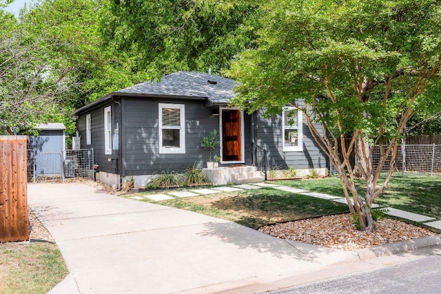 1200 Cullen Ave Unit B, Austin, TX 78757 - view of front of property featuring fence, a front lawn, and roof with shingles