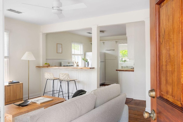 1200 Cullen Ave Unit B, Austin, TX 78757 - living room featuring wood finished floors, visible vents, ceiling fan, and decorative columns