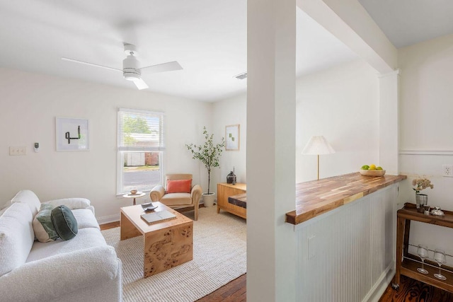 1200 Cullen Ave Unit B, Austin, TX 78757 - living area with a ceiling fan, wood finished floors, baseboards, visible vents, and decorative columns