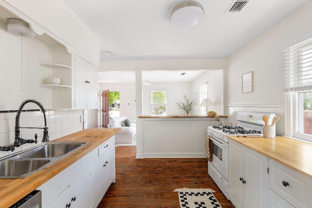 1200 Cullen Ave Unit B, Austin, TX 78757 - kitchen with butcher block countertops, white range with gas cooktop, open shelves, and a sink