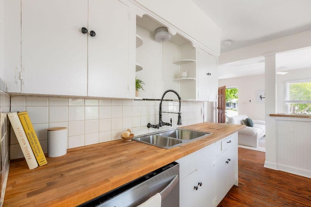 1200 Cullen Ave Unit B, Austin, TX 78757 - kitchen with open shelves, white cabinets, backsplash, stainless steel dishwasher, and dark wood finished floors