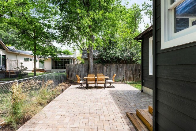 1200 Cullen Ave Unit B, Austin, TX 78757 - view of patio / terrace featuring outdoor dining area and a fenced backyard