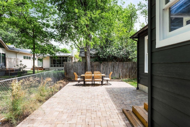 1200 Cullen Ave Unit B, Austin, TX 78757 - fenced backyard with outdoor dining space and a patio