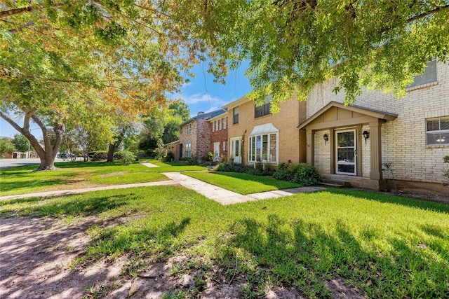 1859 Coronado Hills Dr, Austin, TX 78752 - view of front of property with brick siding and a front lawn