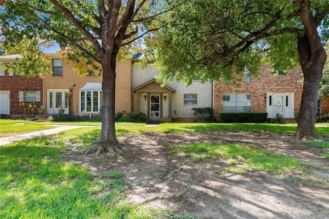 1859 Coronado Hills Dr, Austin, TX 78752 - view of front of house with brick siding and a front yard