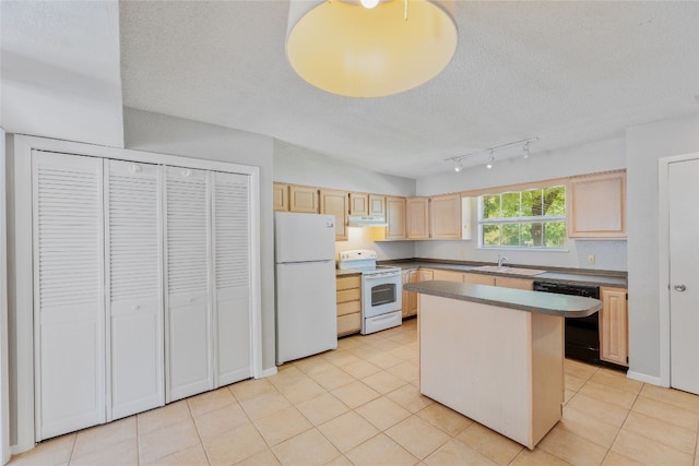 kitchen featuring light brown cabinets, light tile patterned floors, a sink, white appliances, and a textured ceiling