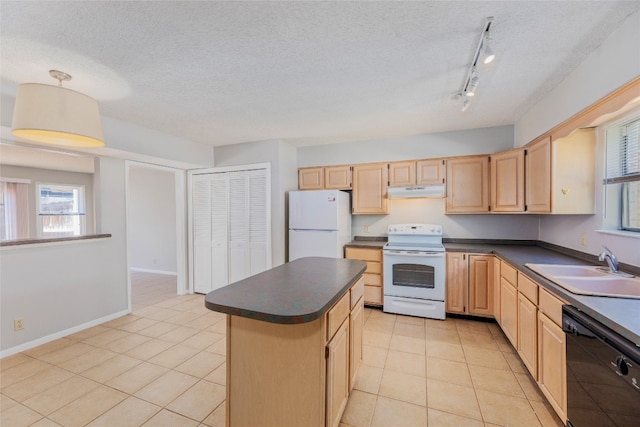 kitchen with dark countertops, light brown cabinets, and white appliances