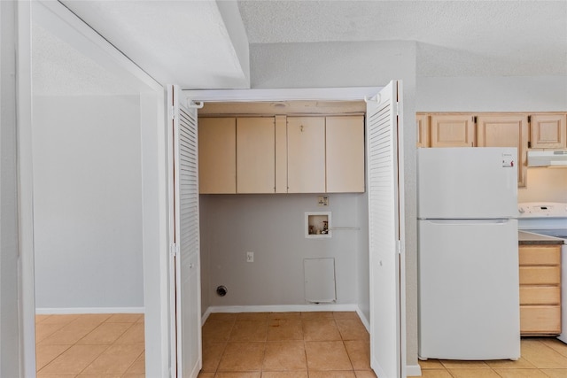 1859 Coronado Hills Dr, Austin, TX 78752 - washroom with washer hookup, light tile patterned floors, and baseboards