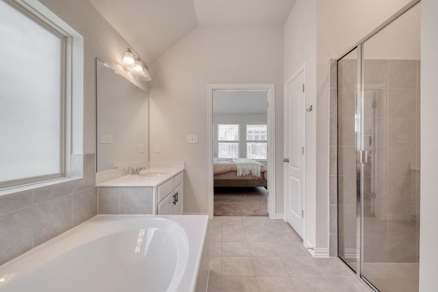 bathroom featuring ensuite bathroom, vanity, tile patterned flooring, and a shower stall