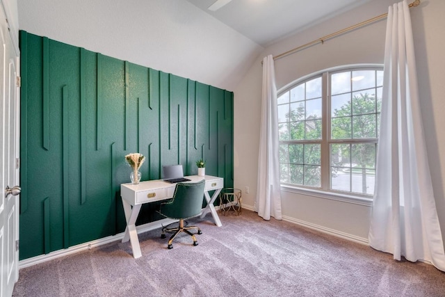 office featuring baseboards, lofted ceiling, a healthy amount of sunlight, and carpet