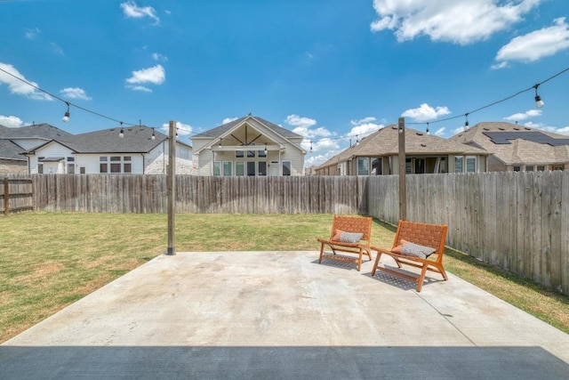 view of patio / terrace with a fenced backyard and a residential view