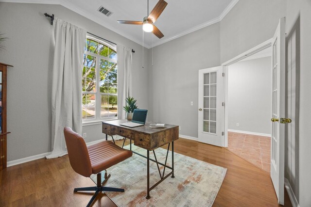 1107 Saint John Ct, Pflugerville, TX 78660 - office area featuring wood finished floors, visible vents, french doors, crown molding, and ceiling fan