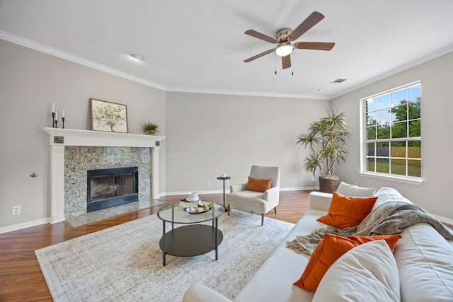 1107 Saint John Ct, Pflugerville, TX 78660 - living room featuring wood finished floors, ornamental molding, ceiling fan, baseboards, and visible vents