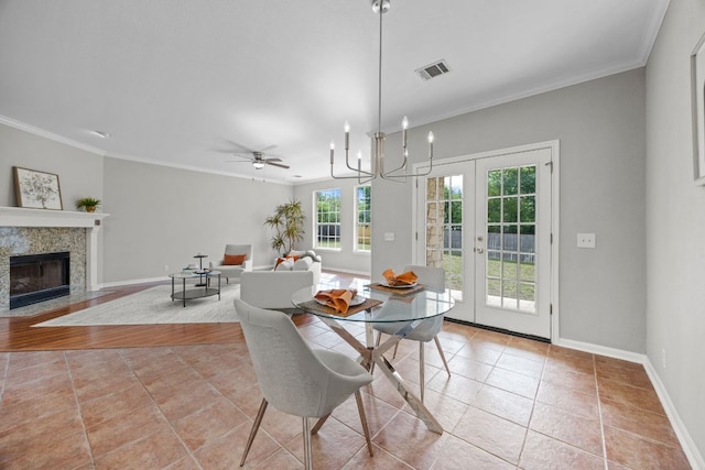 1107 Saint John Ct, Pflugerville, TX 78660 - dining area featuring baseboards, visible vents, light tile patterned floors, and ornamental molding