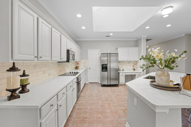 1107 Saint John Ct, Pflugerville, TX 78660 - kitchen with recessed lighting, decorative backsplash, ornamental molding, white cabinets, and appliances with stainless steel finishes