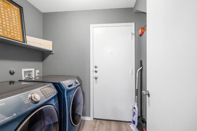 300 Beech Dr, Kyle, TX 78640 - laundry area featuring washing machine and dryer and light wood finished floors