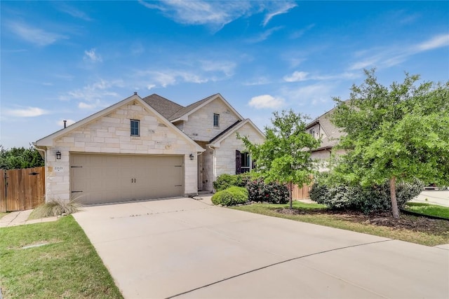 22621 Fountaingrass Ln, Lago Vista, TX 78645 - view of front of house featuring driveway, stone siding, an attached garage, and fence