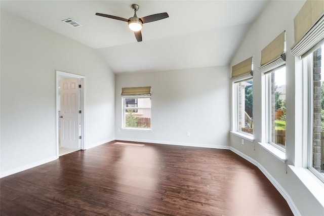 22621 Fountaingrass Ln, Lago Vista, TX 78645 - spare room featuring visible vents, baseboards, vaulted ceiling, dark wood-type flooring, and a ceiling fan