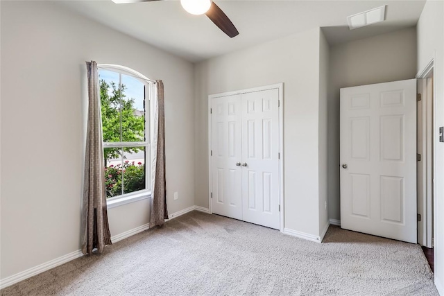 22621 Fountaingrass Ln, Lago Vista, TX 78645 - unfurnished bedroom with visible vents, baseboards, carpet flooring, and multiple windows