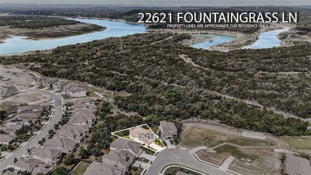 22621 Fountaingrass Ln, Lago Vista, TX 78645 - bird's eye view with a residential view, a water view, and a view of trees