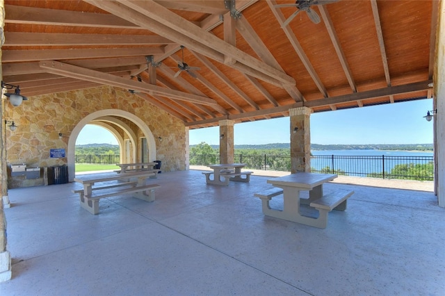 22621 Fountaingrass Ln, Lago Vista, TX 78645 - view of patio featuring a ceiling fan, a water view, and fence