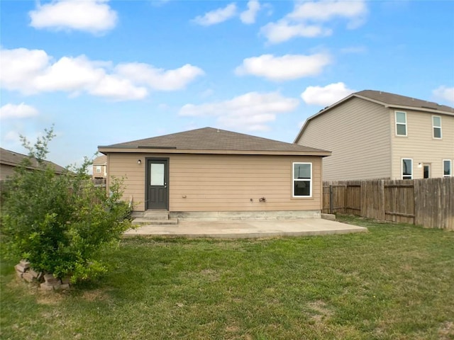 115 Millers Loop, Jarrell, TX 76537 - back of property featuring a lawn, a patio area, and fence private yard