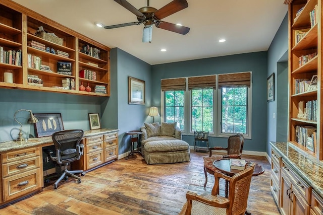 office with built in desk, recessed lighting, baseboards, light wood-style flooring, and ceiling fan