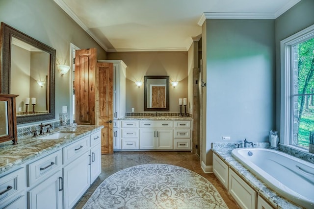 full bathroom with two vanities, a garden tub, ornamental molding, and a sink