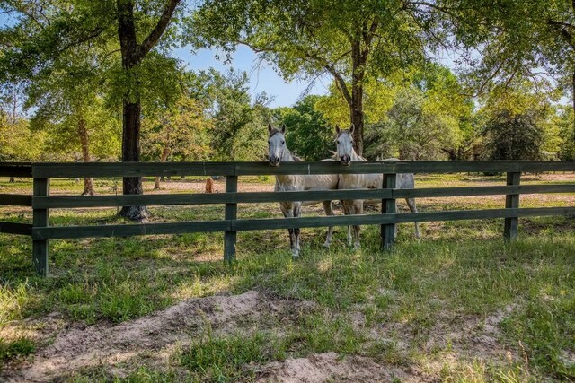 view of gate with fence
