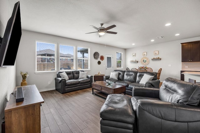 337 Akumal St, Leander, TX 78641 - living room with ceiling fan, dark wood-style floors, recessed lighting, and baseboards