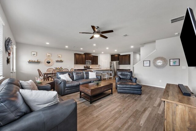 337 Akumal St, Leander, TX 78641 - living area featuring a ceiling fan, wood finished floors, recessed lighting, and baseboards