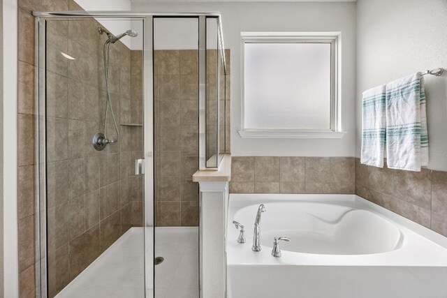 337 Akumal St, Leander, TX 78641 - full bath with a bath and a stall shower