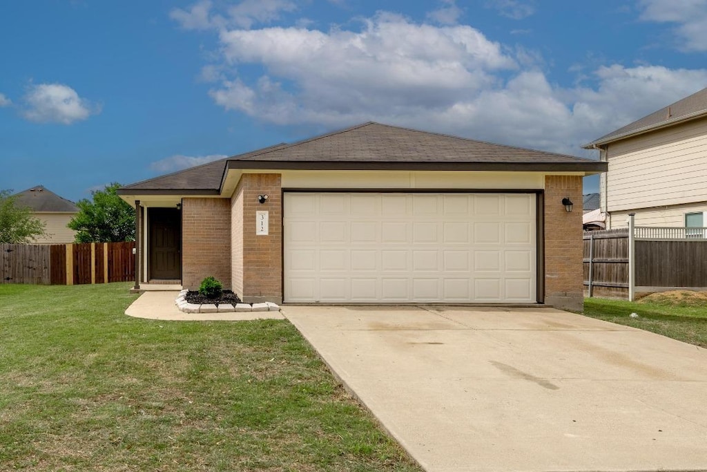 single story home with fence, a shingled roof, a front lawn, and brick siding