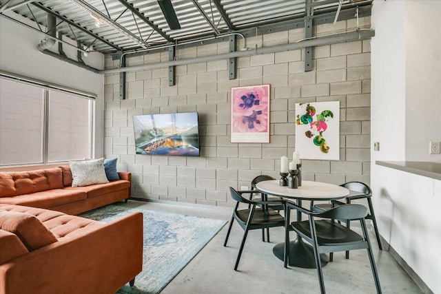 4801 S Congress Ave Unit D6, Austin, TX 78745 - living area with concrete block wall and concrete flooring